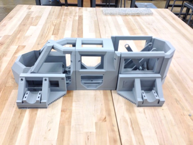 Image of the individual pieces of the 3D printed exoskeleton during fabrication.