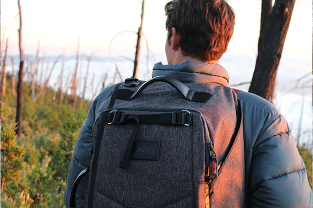 Guy hiking with the paq bag