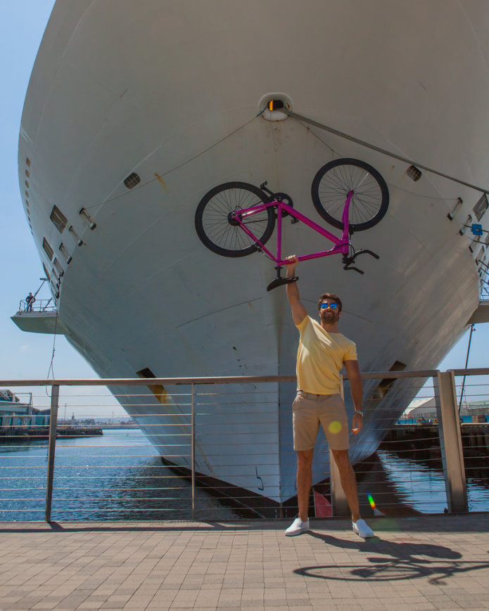 Rob Rast Holding the FLX Babymaker Electric Road Bike Overhead