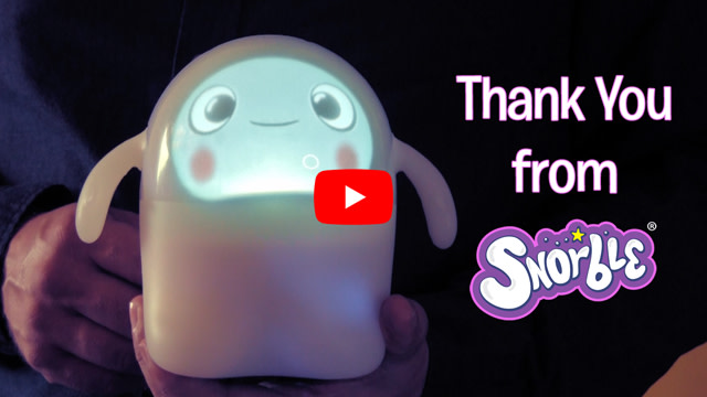 Image contains a photo of Snorble® being held while facing the camera. To the right, there is text that says "Thank You from Snorble".