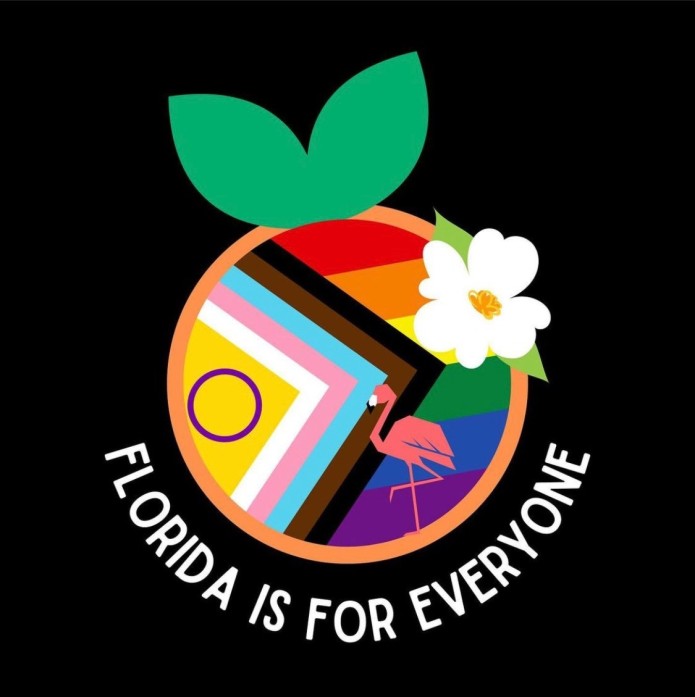 Image description: A design evoking an orange (the fruit), with leaves at the top, and an orange blossom on the side, but with the Intersex-Inclusion Progress Pride Flag and an angular flamingo in the body of the "orange". It's set against a black background. White text curves around the bottom of the shape that reads "Florida is for everyone." Design by Brandon Mead.