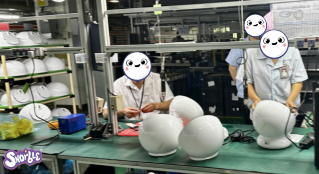 Factory workers work on Lullapod parts.